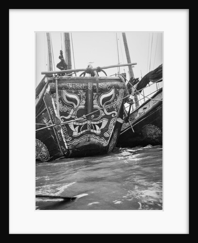 The highly decorative bow of a Hangchow Bay trader type junk moored with other junks at Shanghai by David Watkin Waters