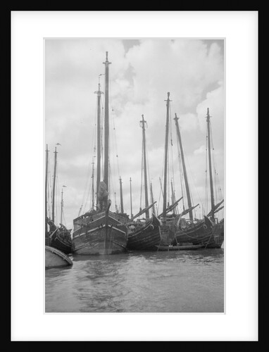 A bow view of the lorcha type junk 0667 moored between other junks at Shanghai by David Watkin Waters
