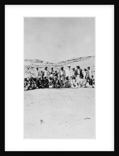 The Senior Naval Officer, Persian Gulf standing between the Sheikh of Dubai and the Sheikh of Henjam with their entourages. by unknown