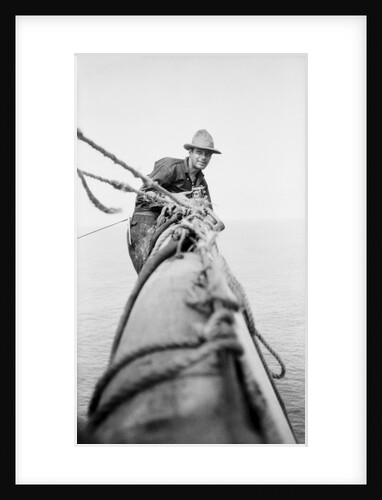 Seaman and photographer Alan Villiers on a yard with camera by unknown