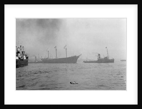 The clipper ship 'Cutty Sark' (1869) being towed from the East India Dock to Greenwich by the tug 'Gondia' (1927) by unknown
