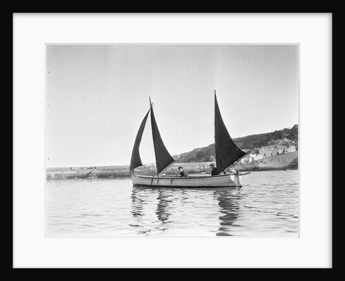 Mounts Bay pilot gig, under sail in Newlyn harbour, setting fore staysail and standing lugs with booms on fore and mizzen masts by unknown