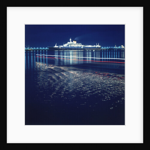 A night shot of an unspecified cruise liner under way by Marine Photo Service