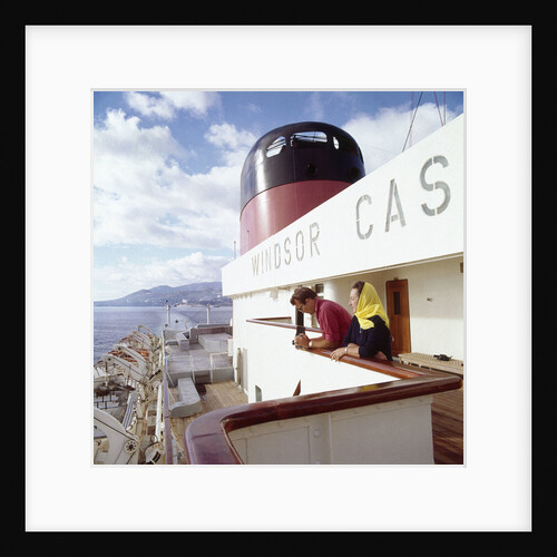 Two passengers enjoy the view from the upper deck of Union-Castle liner 'Windsor Castle' by Marine Photo Service
