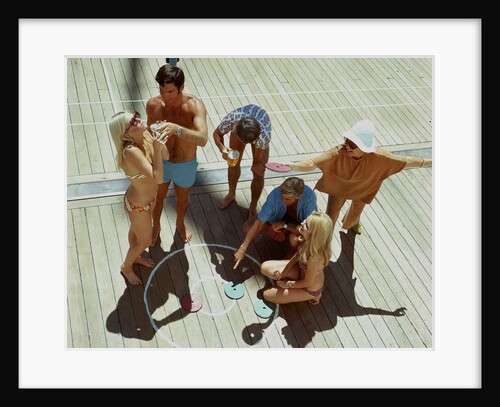 A group of passengers aboard an unspecified cruise ship enjoy a game of deck quoits by Union Castle Line Collection