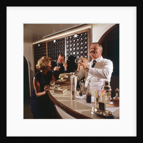 A splendidly moustachioed bartender shakes a cocktail aboard an unspecified cruise liner by Union Castle Line Collection