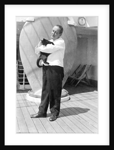 Steward with ship's cat by Marine Photo Service