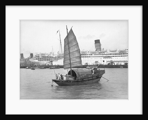 A junk in Hong Kong harbour, 1933 by Marine Photo Service
