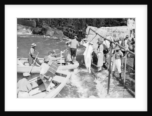 Passengers embarking into local boats from the landing stage, St Helena by Marine Photo Service