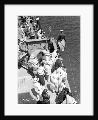 A sailor takes a sounding as the ship approaches the Greek island of Santorini by Marine Photo Service