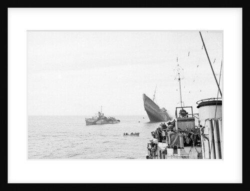 Photograph of Windsor Castle (1922) sinking in 1943,  distant port bow view with bow high in the air and escort destroyer 'Farndale' (1940) standing by 'Eskimo' in foreground by Lt JE Manners