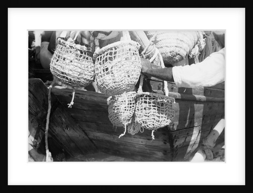 Divers' baskets filled with shells by Alan Villiers