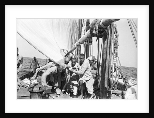 The crew labour on the mainsail after Haifun by Alan Villiers
