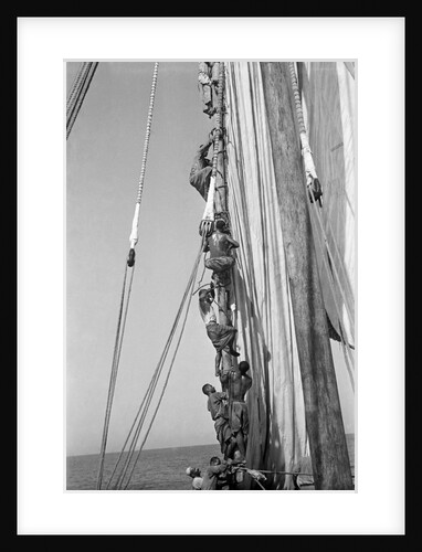 Kuwaiti sailors climbing aloft and working on the lateen yard by Alan Villiers