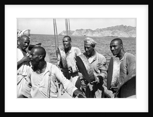 The musical crew of the 'Triumph of Righteousness' sailing into Mutrah Harbour, Oman by Alan Villiers