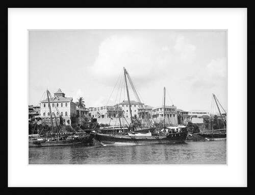Booms anchored along the waterfront at Mombasa, Kenya by Alan Villiers