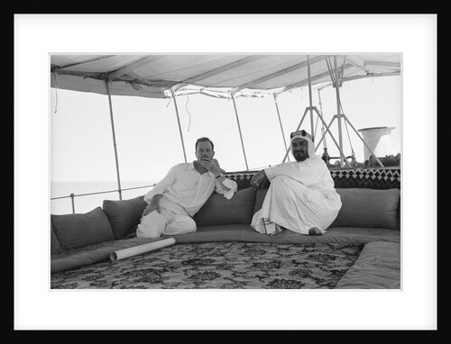 Sheikh Ahmad bin Jabir al-Sabah, Ruler of Kuwait, seated with the British Political Agent, Major A. C. Galloway by Alan Villiers