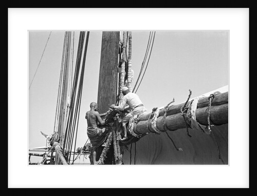 Sailors bend the halyards of the mainsail, Zanzibar by Alan Villiers