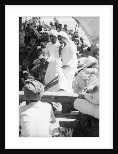 Nejdi and the mate, Hamed bin Salim, check passengers from Hadramuaut crowded on board the 'Triumph' by Alan Villiers