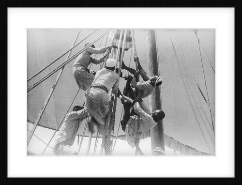 Sailors climbing the halyard blocks by Alan Villiers