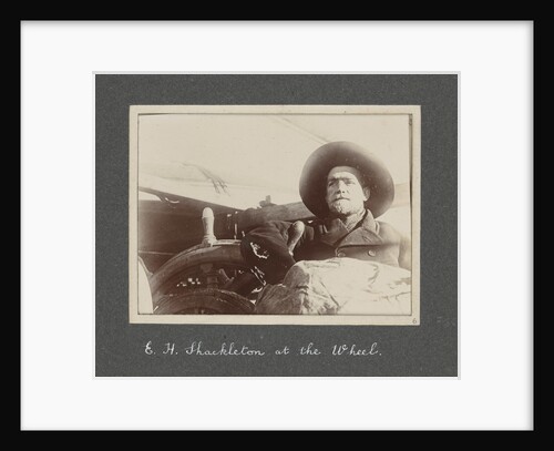 E. H. Shackleton at the wheel from National Antarctic Expedition photo album by Sir Ernest Henry Shackleton