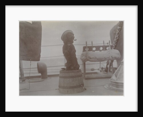 Phyllis 1st Lieutenant spaniel dog on top of barrel with hat and pipe. From an album relating to the Royal Naval Service of Cdr John Rodolph Peronet Thompson RN. by John Rodolph Peronet Thompson