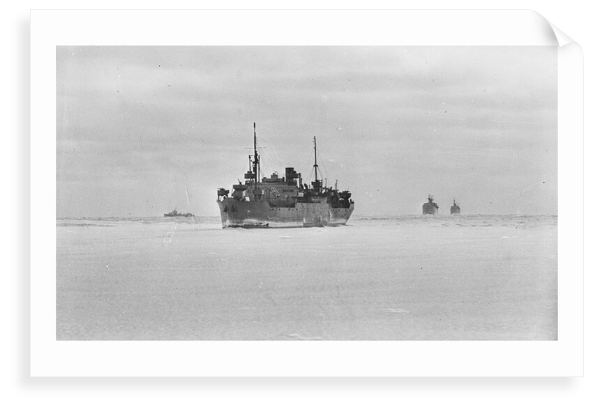 Merchant ships steaming through thin sea ice by unknown