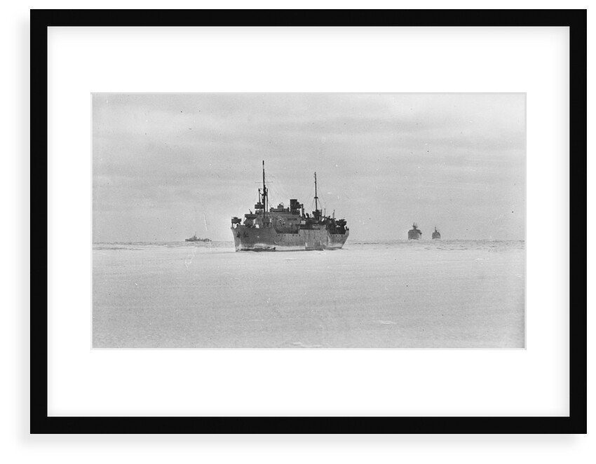 Merchant ships steaming through thin sea ice by unknown