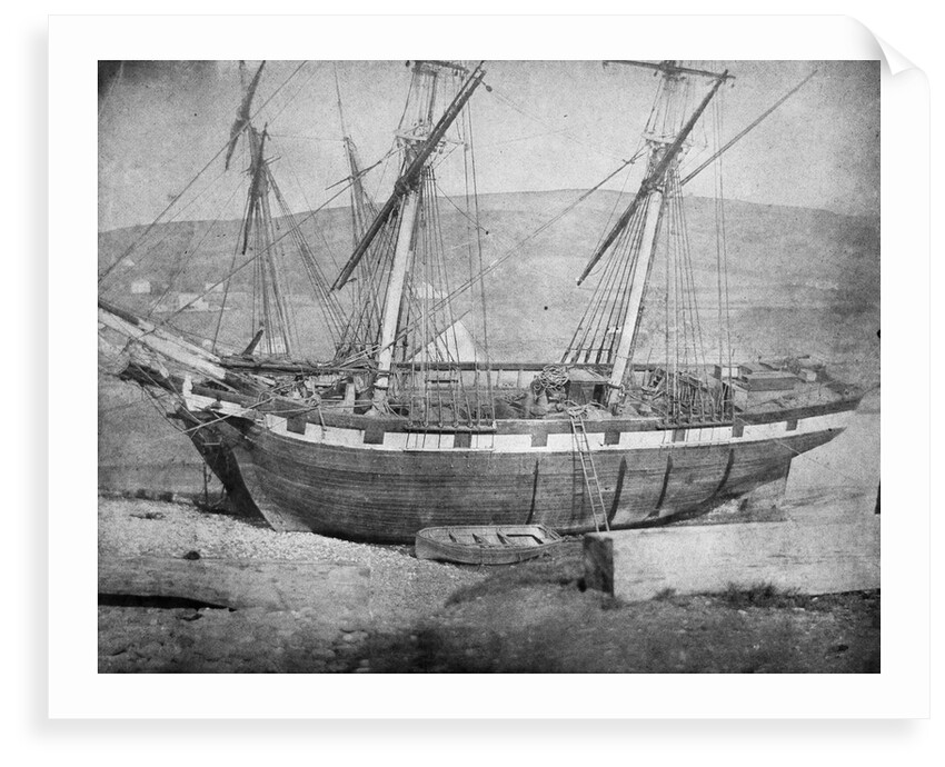 Broadside view of two unidentified vessels at low tide by unknown