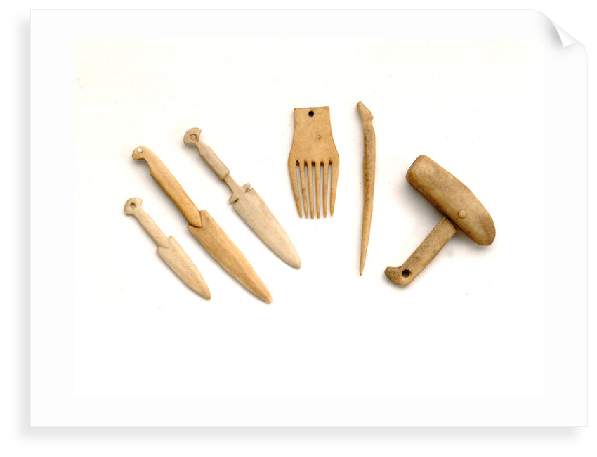 Ivory model of a snow knife, awl, comb by unknown