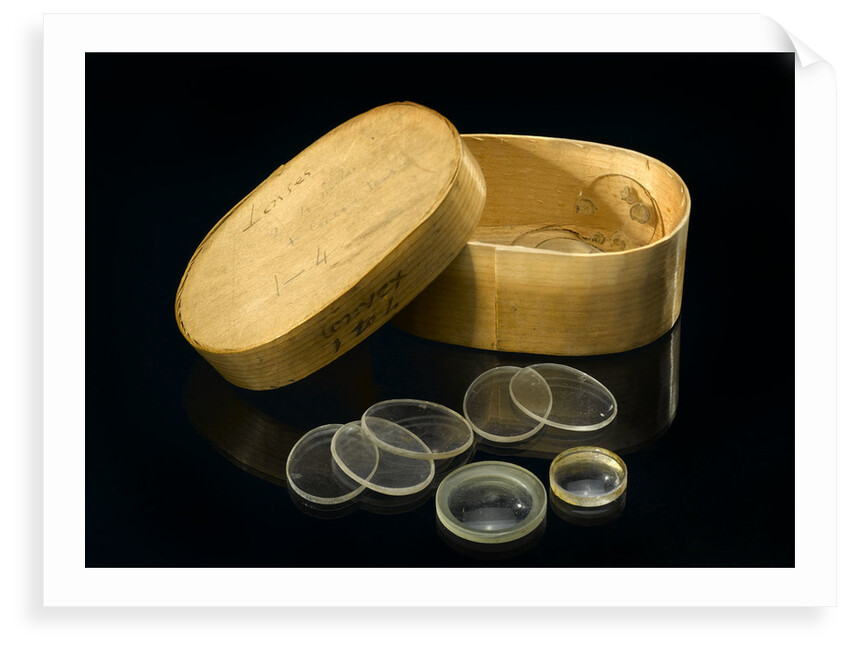Nine lenses of various sizes in a box by Unknown