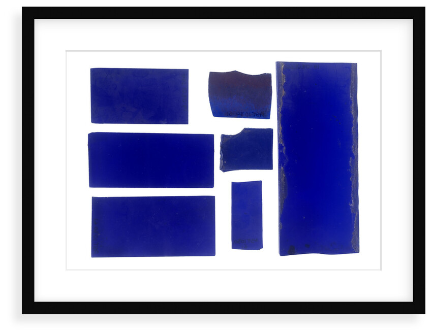 Seven pieces of cobalt blue pieces of glass in a bag by unknown