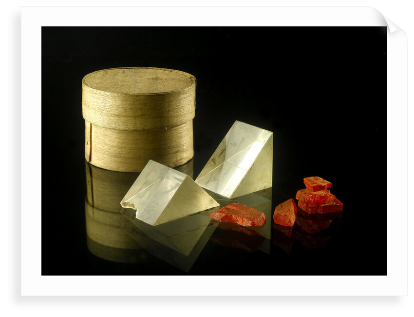 Pill box containing two prisms and red coloured crystals by unknown