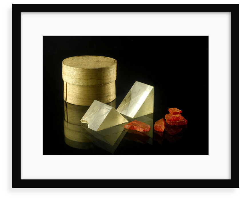 Pill box containing two prisms and red coloured crystals by unknown