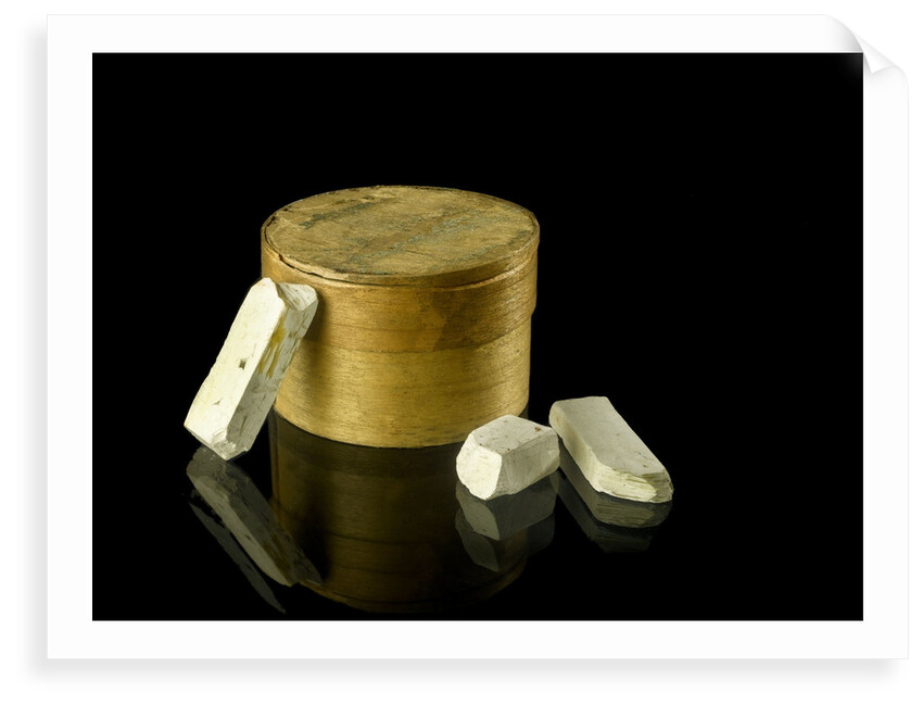 Pill box containing eight chalky plaster like crystals by unknown