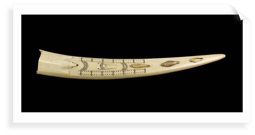 A cribbage board and two pegs, carved from a walrus tusk with a polar bear, walrus head, and three seals carved in relief by Inuit