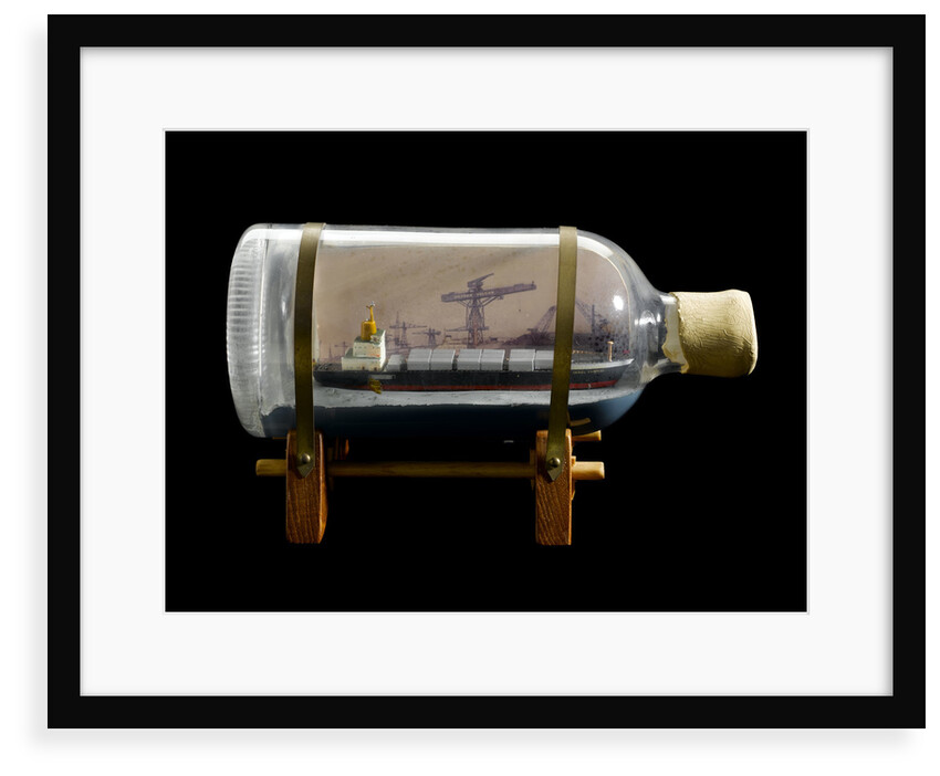 A bottle containing a model ship by unknown