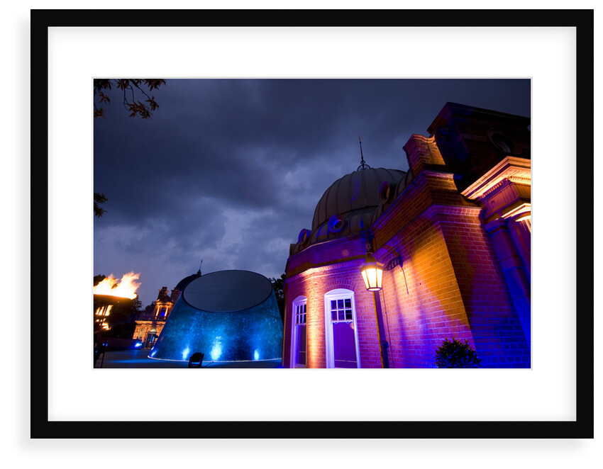 Night-time view of illuminated Royal Observatory, Greenwich, including the Peter Harrison Planetarium, Astronomy Centre (South Building) and Altazimuth Building by National Maritime Museum
