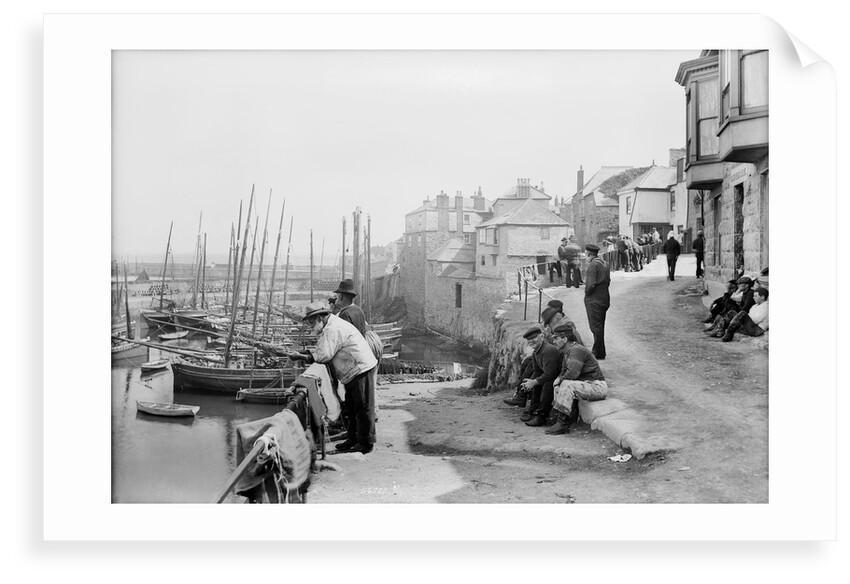 Newlyn Harbour, Cornwall. The old harbour with fishermen looking out to sea. by Francis Frith & Co.