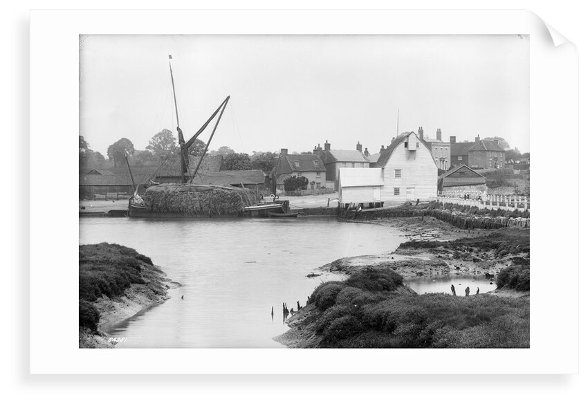 St. Osyth, Essex, the river with hay laden spritsail barge and village by unknown