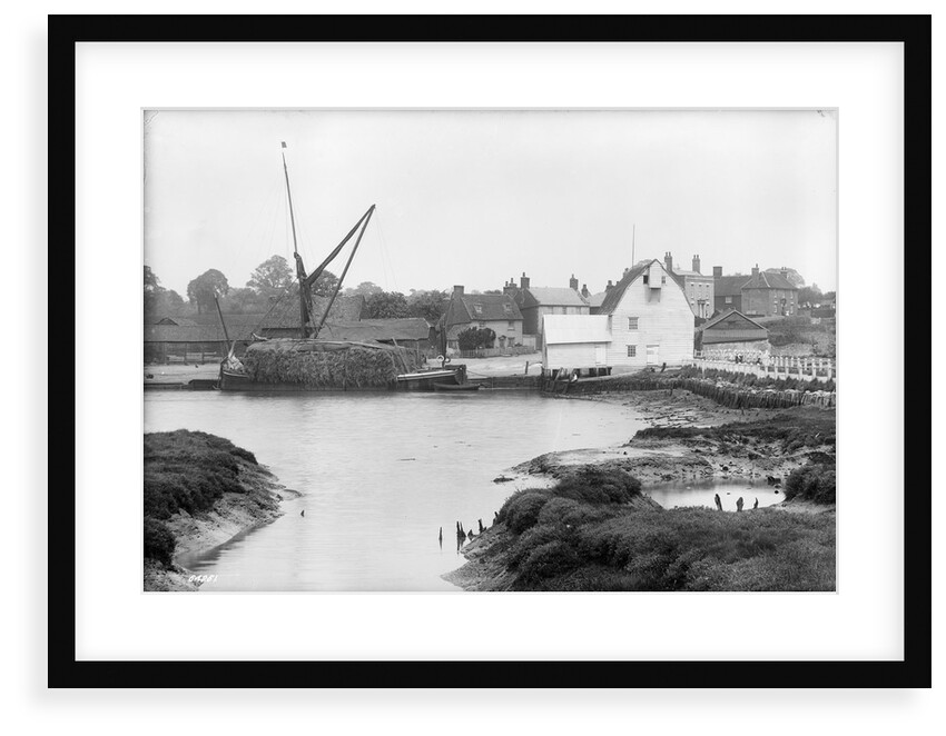 St. Osyth, Essex, the river with hay laden spritsail barge and village by unknown