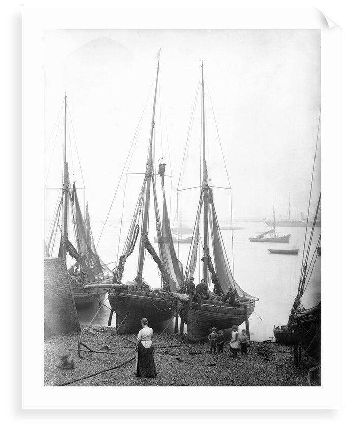 View across River Thames with fishing bawleys drawn up onto the foreshore. Gravesend, Kent by unknown
