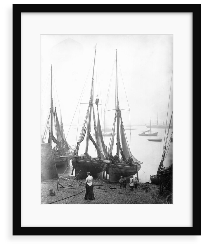 View across River Thames with fishing bawleys drawn up onto the foreshore. Gravesend, Kent by unknown