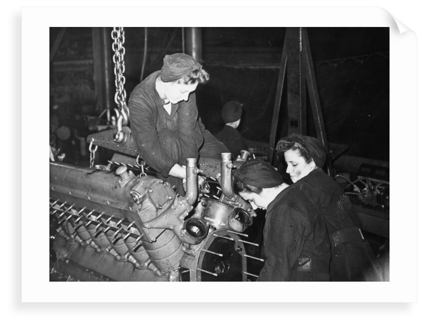 A WREN dismantling a large marine engine by unknown