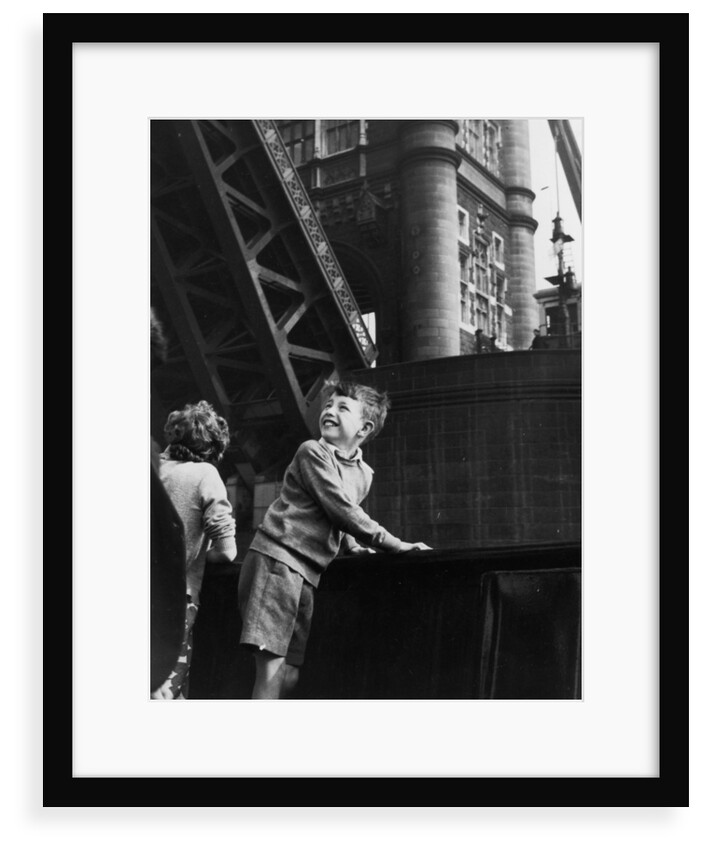 Delighted children on board the pleasure steamer 'Golden Eagle'as it passes beneath Tower Bridge by unknown