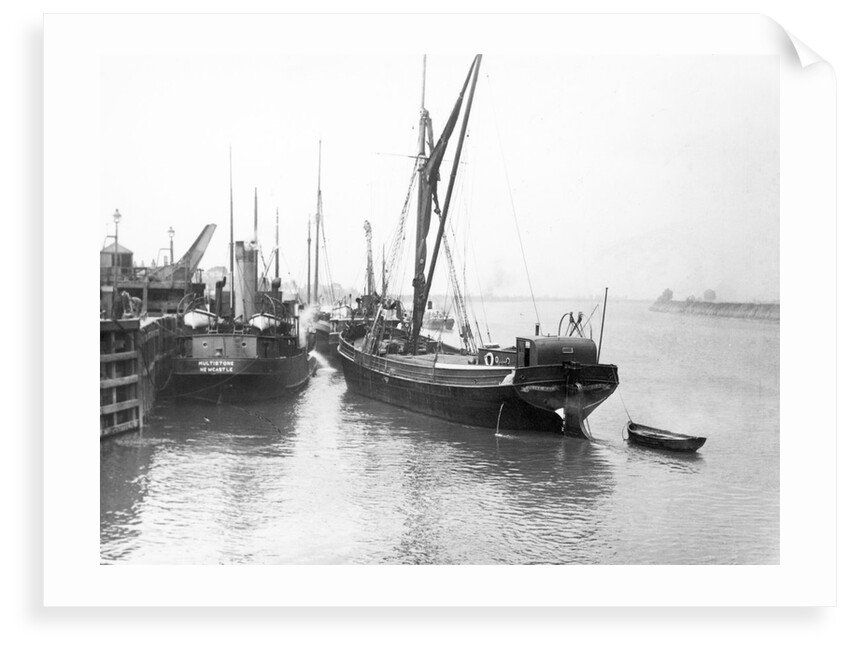 The 'Olive May' (1920), a port quarter view of the barge motoring to quayside with her tender in tow (sails furled) by Anonymous