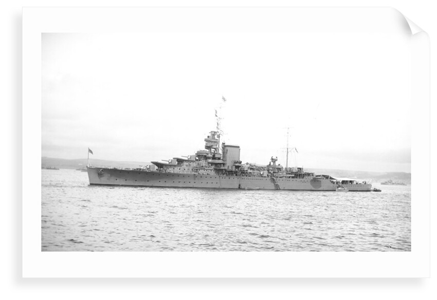 Light cruiser HMS 'Effingham' (1921) in 1939 at anchor with awning rigged aft by unknown