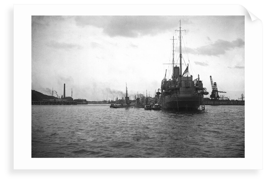 HMS 'Titania' (1915) submarine depot ship, moored at Portland with 4 submarines alongside by unknown