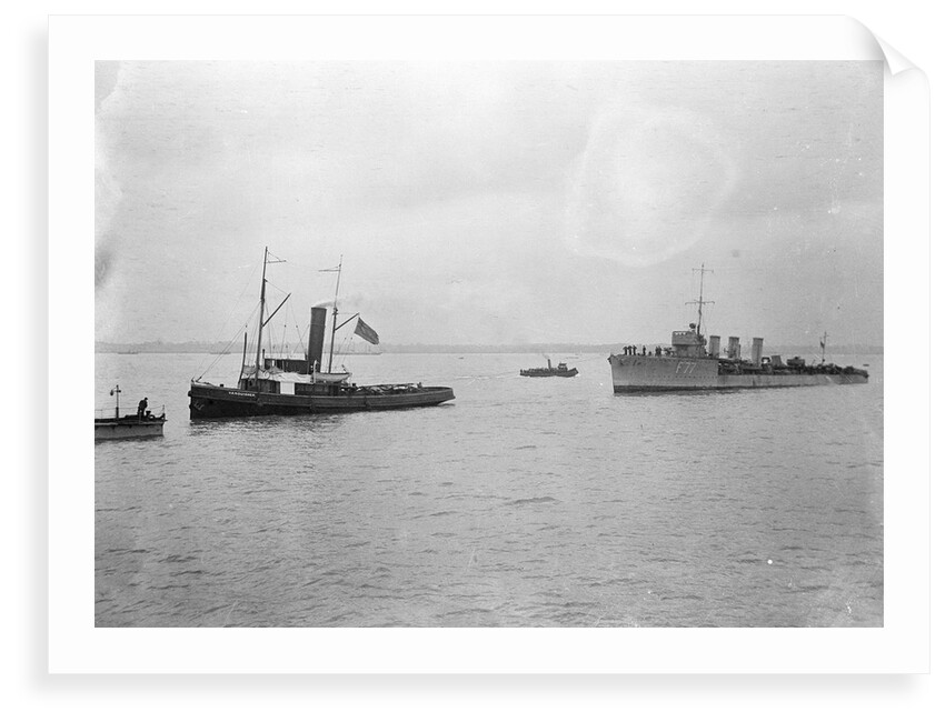 Rescue tug HMS 'Vanquisher' (1899) entering the floating dock at Harwich with the mined destroyer 'Thisbe' (1917) in tow by unknown