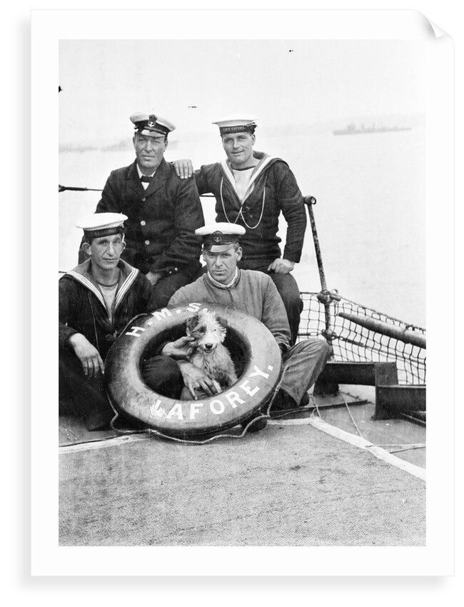 Photograph of four petty officers on board 'Laforey' (1913) at Harwich in 1915-1916 with the ship's dog mascot by unknown